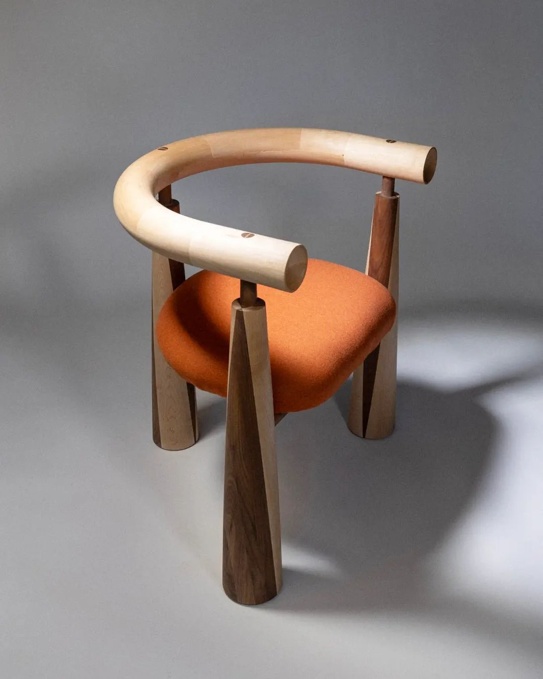 A uniquely designed chair with an asymmetrical backrest