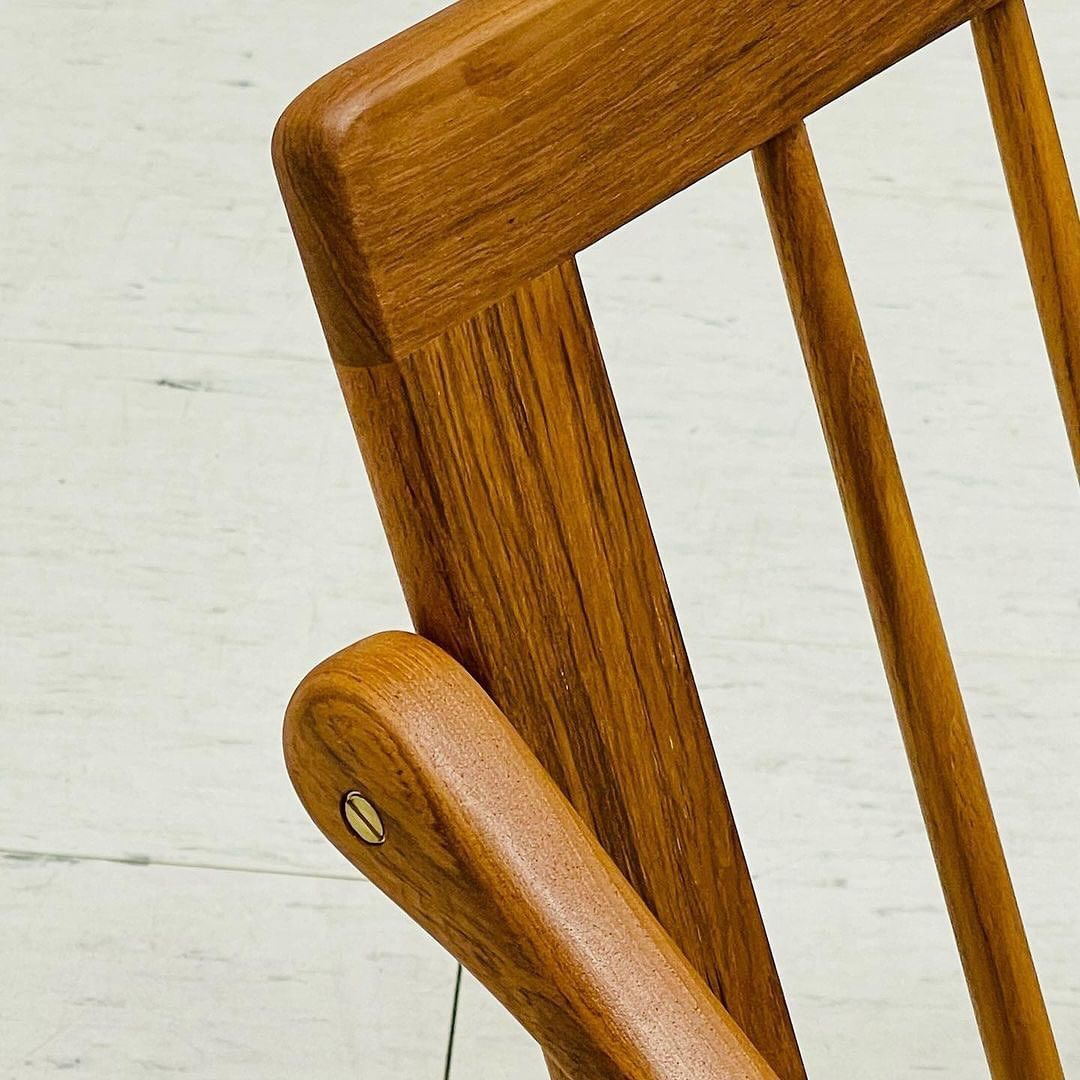 A detail of a well-crafted wooden chair showing the texture and joinery