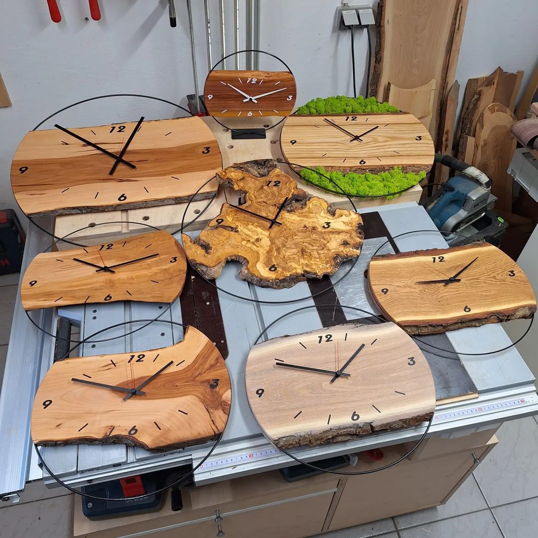 Handcrafted wooden clocks on a workbench