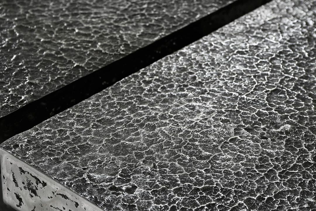 A textured black and white surface exhibiting an intricate pattern