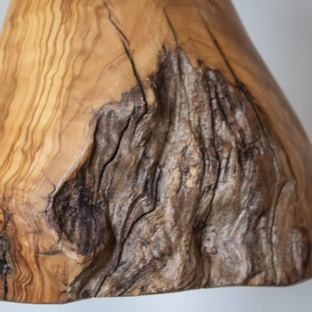 A richly textured piece of wood art highlighting the natural patterns and grain