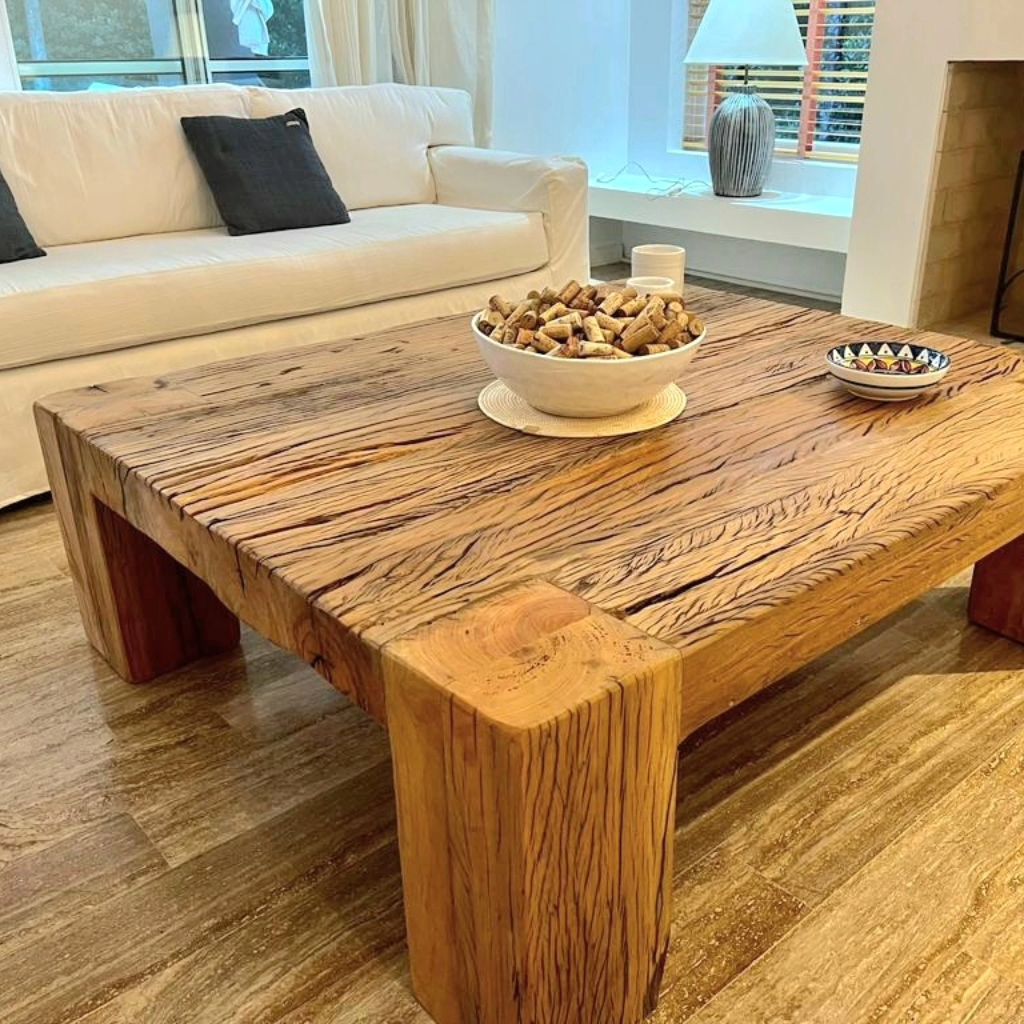 A minimalist living room with a solid wood coffee table