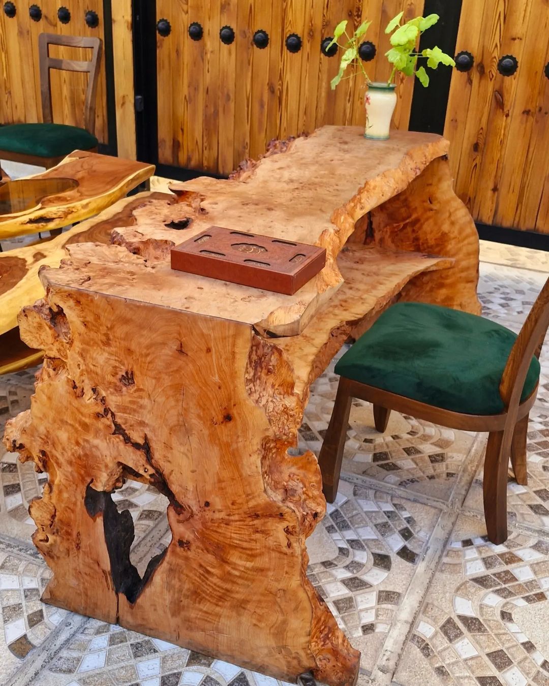 A unique wooden slab table with a natural edge