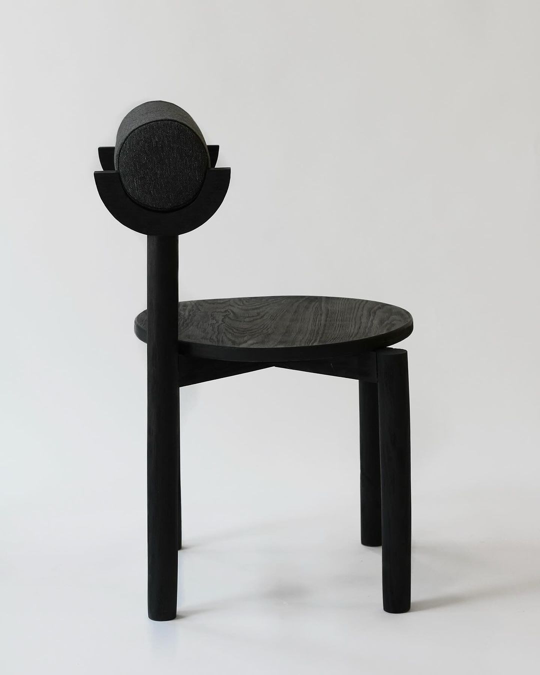 Abstract black chair with circular back detail