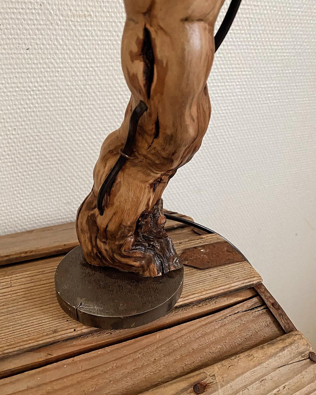 A uniquely crafted wooden sculpture, showcasing the fluid beauty of natural forms