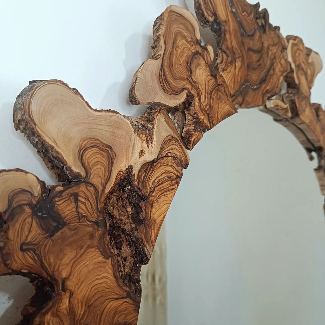 An artful wooden wall sculpture with natural edges and rich tones