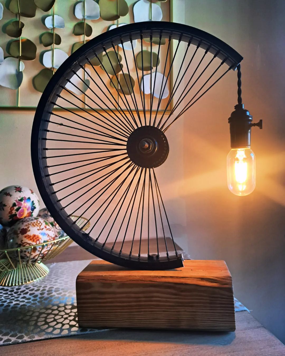 A repurposed bicycle wheel transformed into a unique table lamp