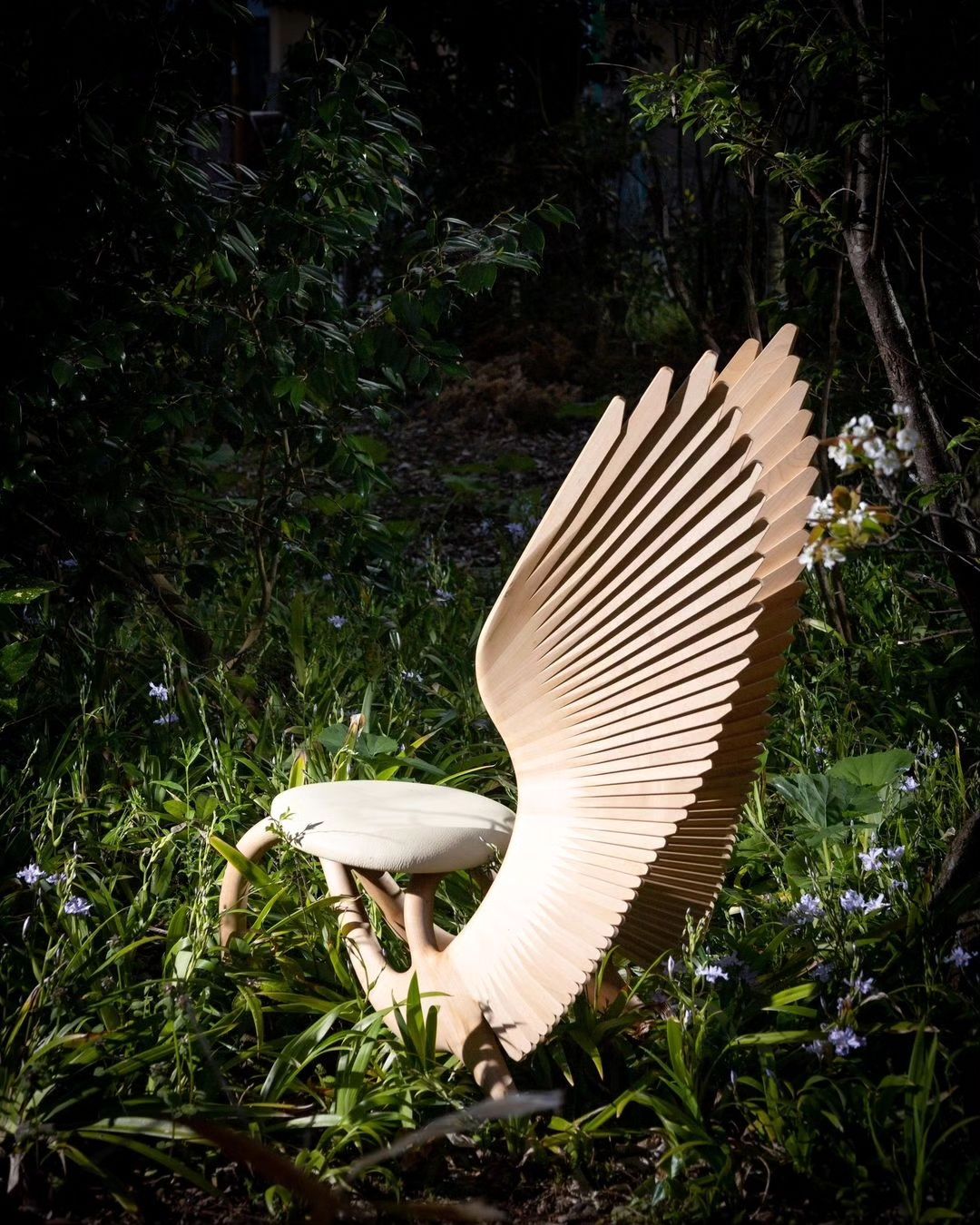 Artistic Wooden Bench with Wings Design