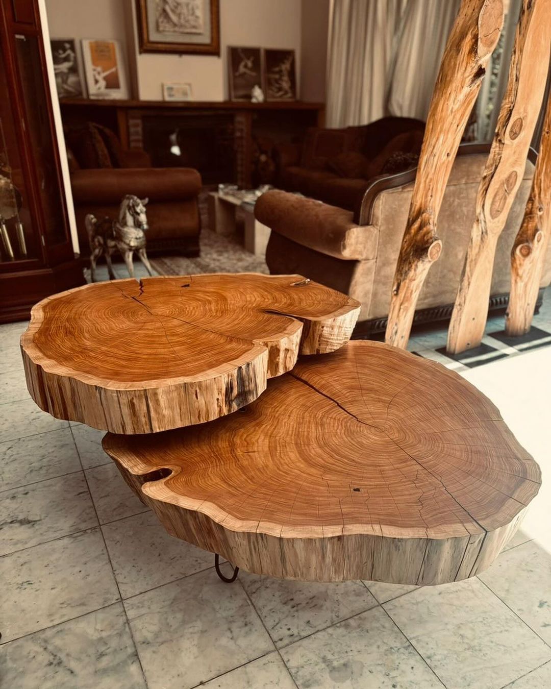 A uniquely crafted wooden coffee table resembling stacked tree cross-sections