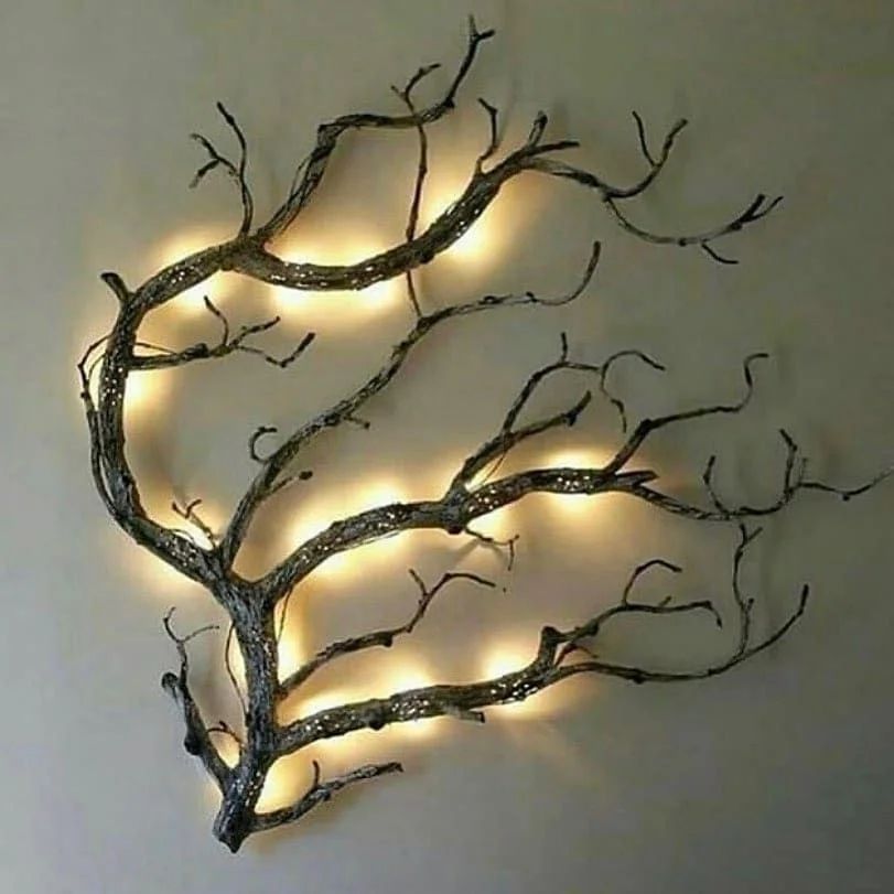 Artistic wall-mounted tree branch light fixture