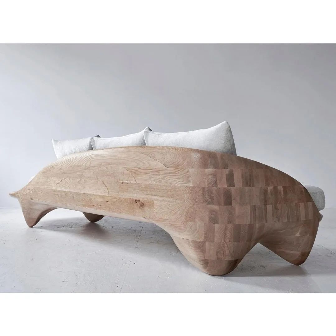 Unique wooden bed with a fluid design and integrated side tables