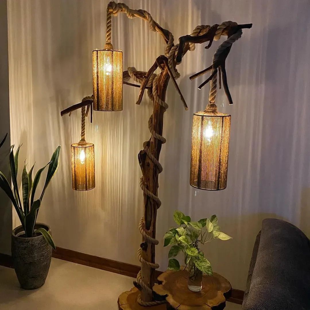 A uniquely crafted floor lamp with twisted wood design and hanging shades