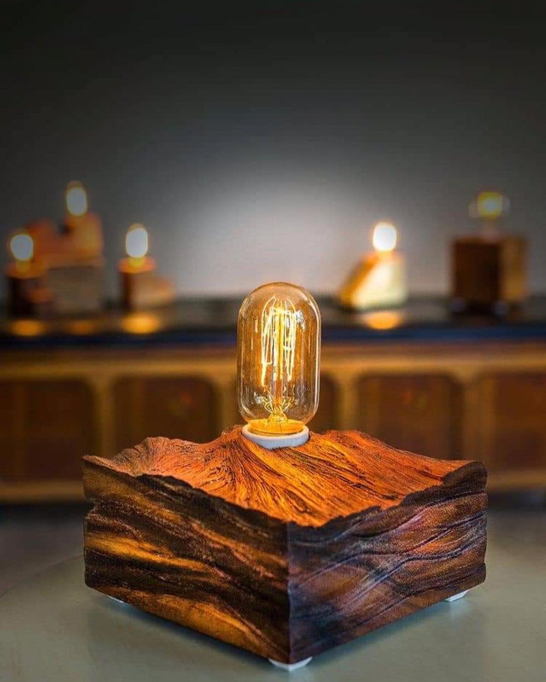 A unique wooden base lamp with an Edison bulb