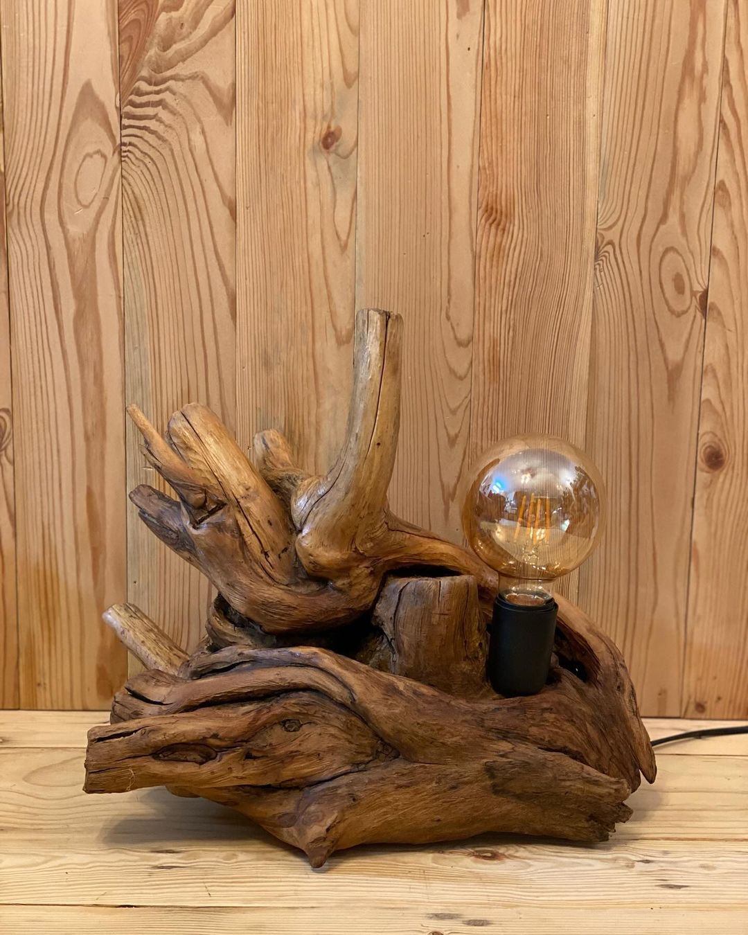 Unique wooden lamp with a clear bulb