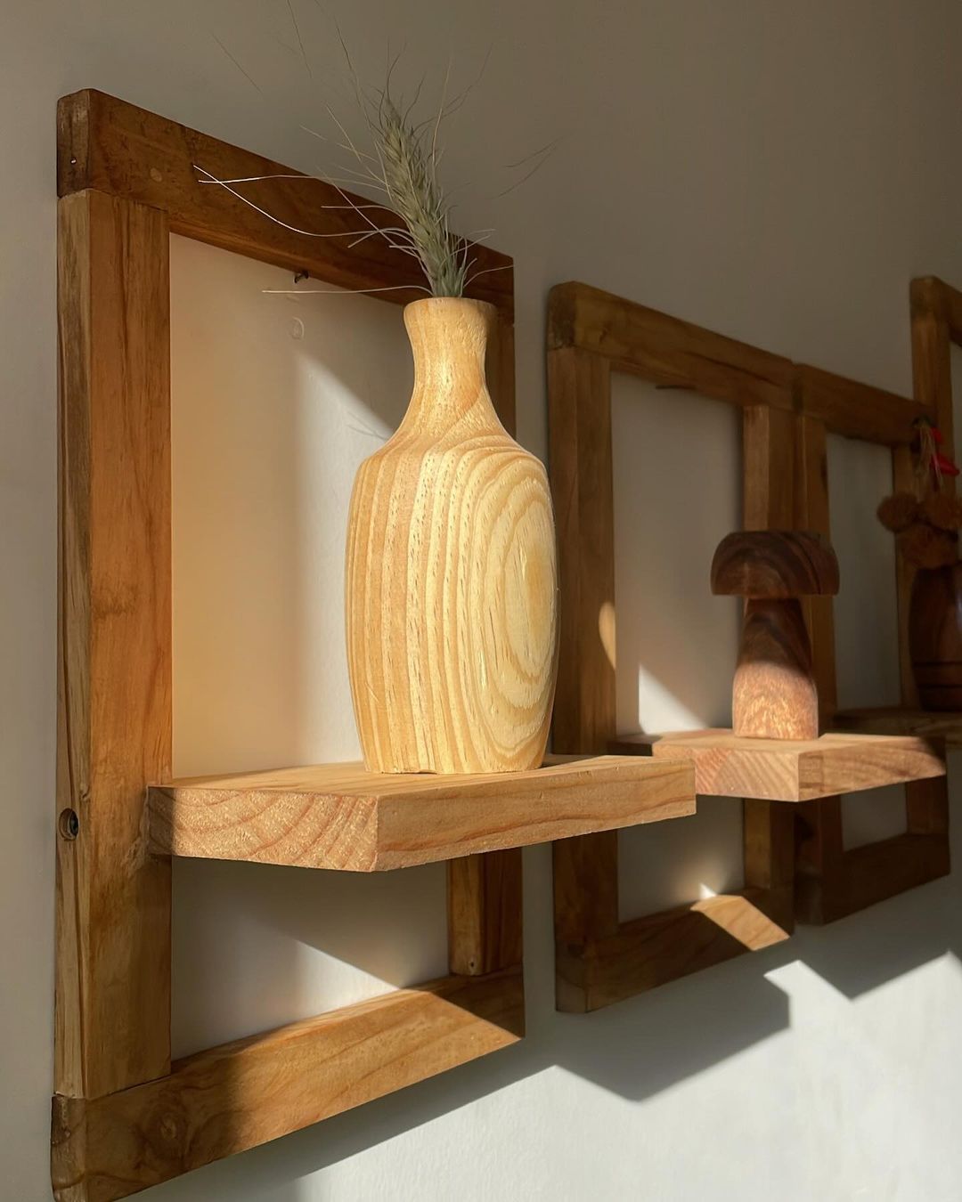 Wooden shelves with a decorative vase