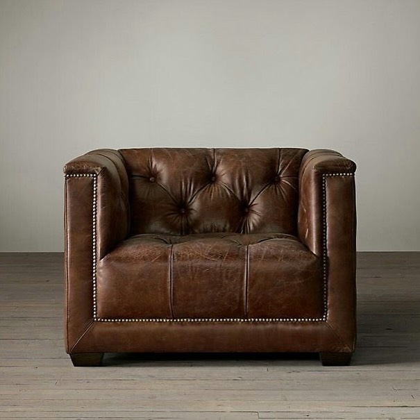 A classic leather armchair with tufted detail