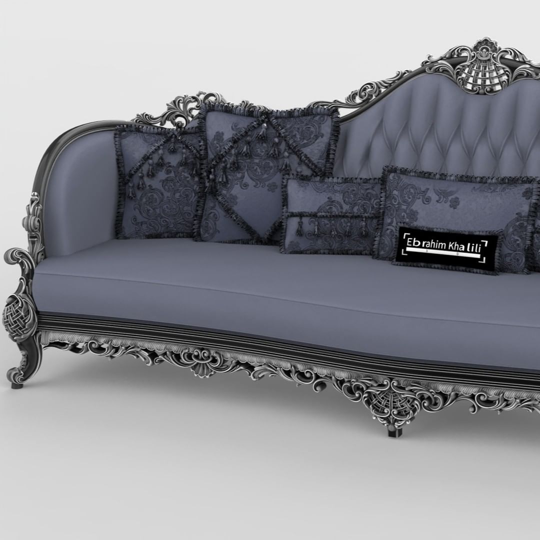 An ornately designed classic chaise longue with intricate patterns and plush cushions