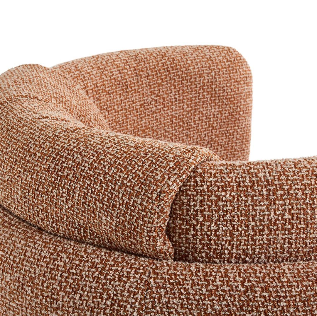 A textured brown fabric armchair