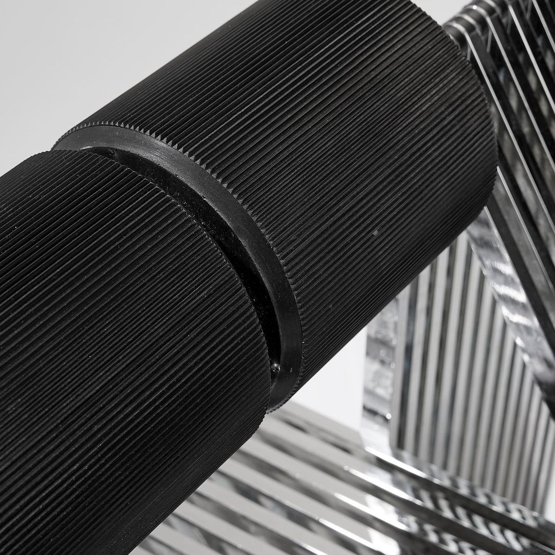 A close-up view of overlapping carbon fiber layers