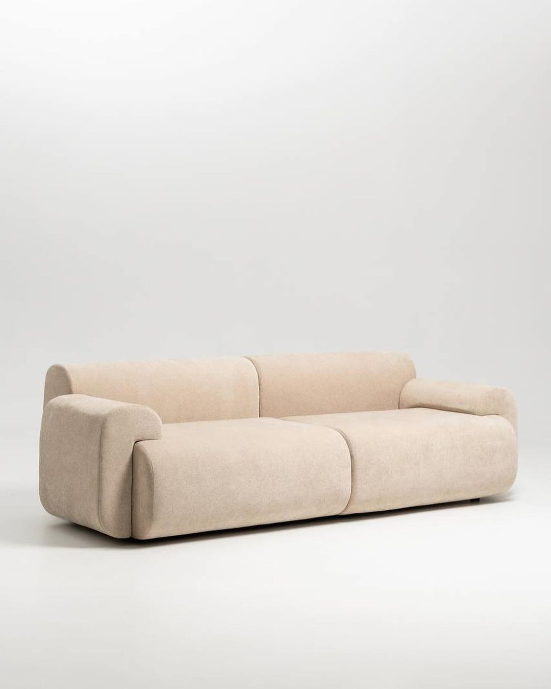 Contemporary beige sofa with a minimalist design