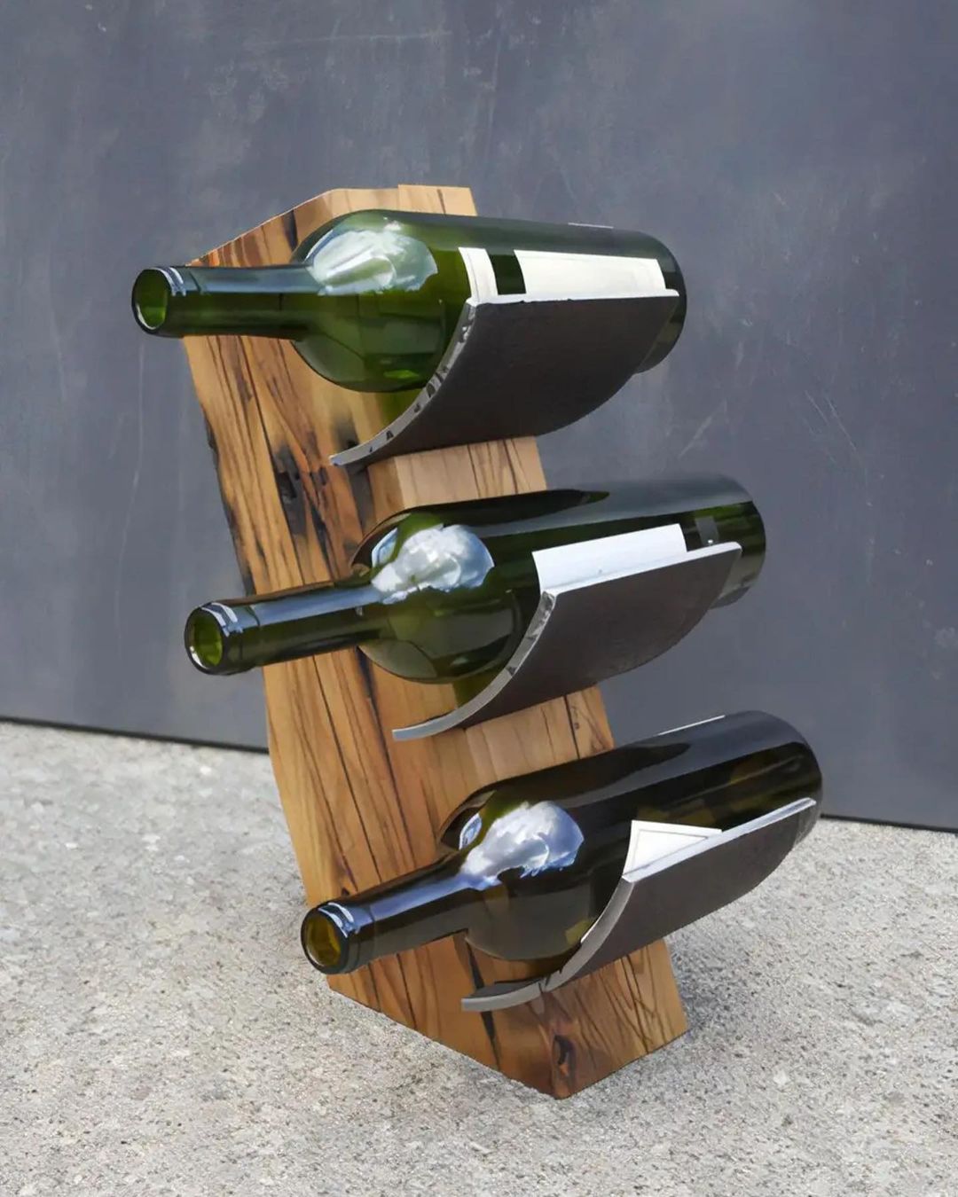 A modern and industrial-inspired wine rack carved from a single piece of wood with metal holders for a unique touch