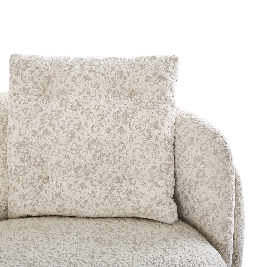 Cozy and stylish armchair with a patterned throw pillow