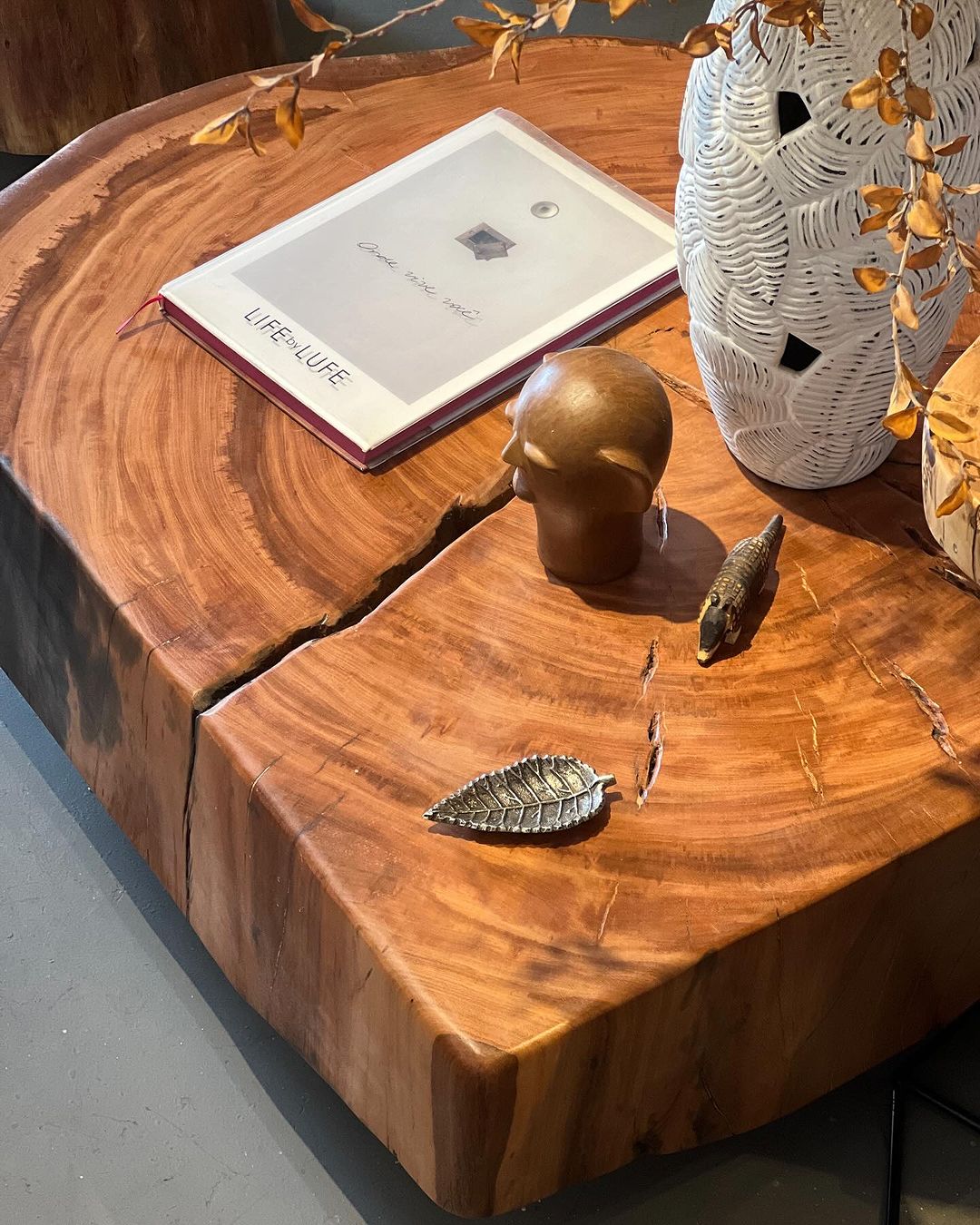 A rustic wooden table with decorative items