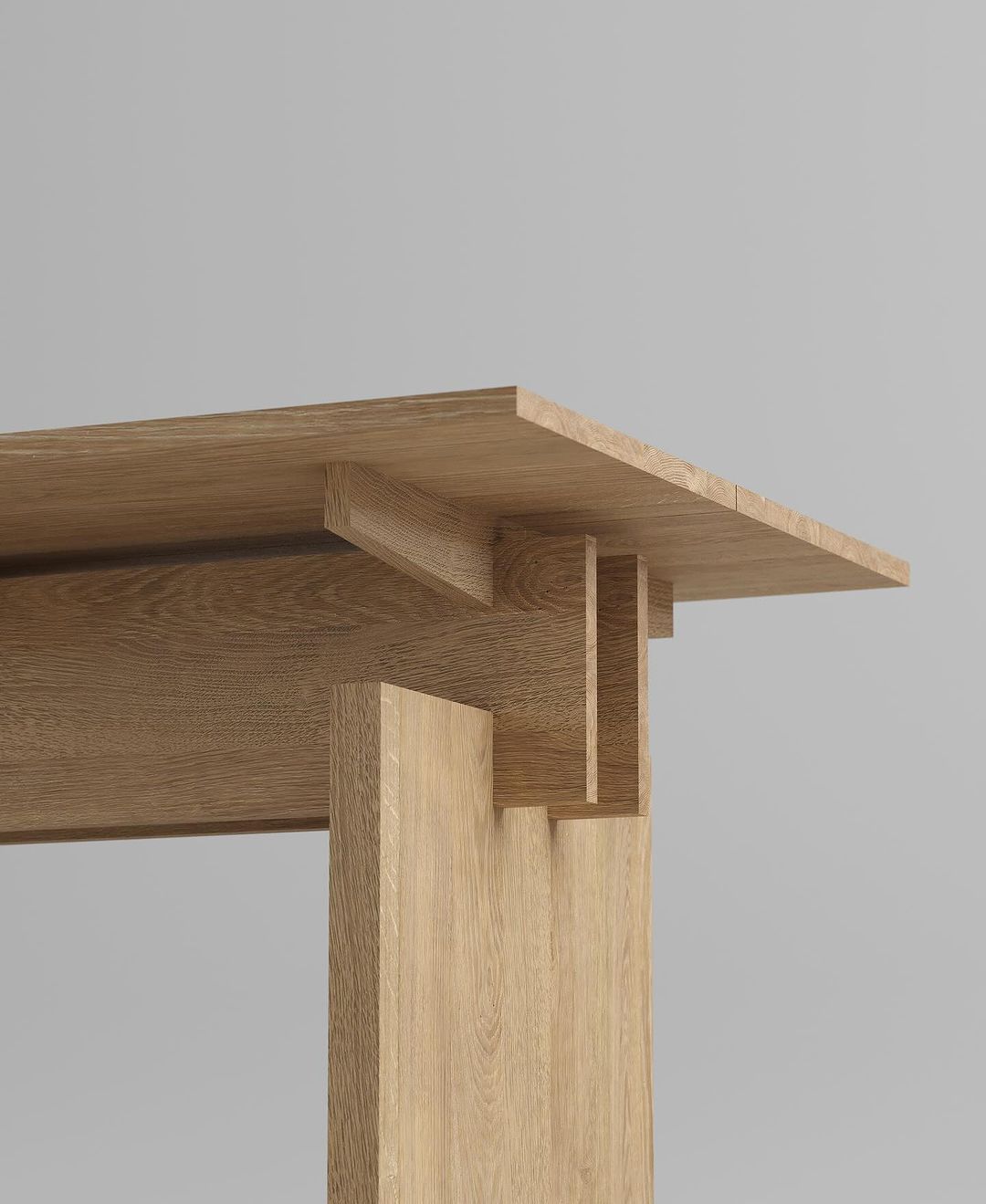 A close-up view of a wooden table joint showcasing the craftsmanship