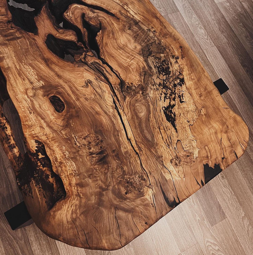 Live edge wood table with a unique grain pattern and natural imperfections