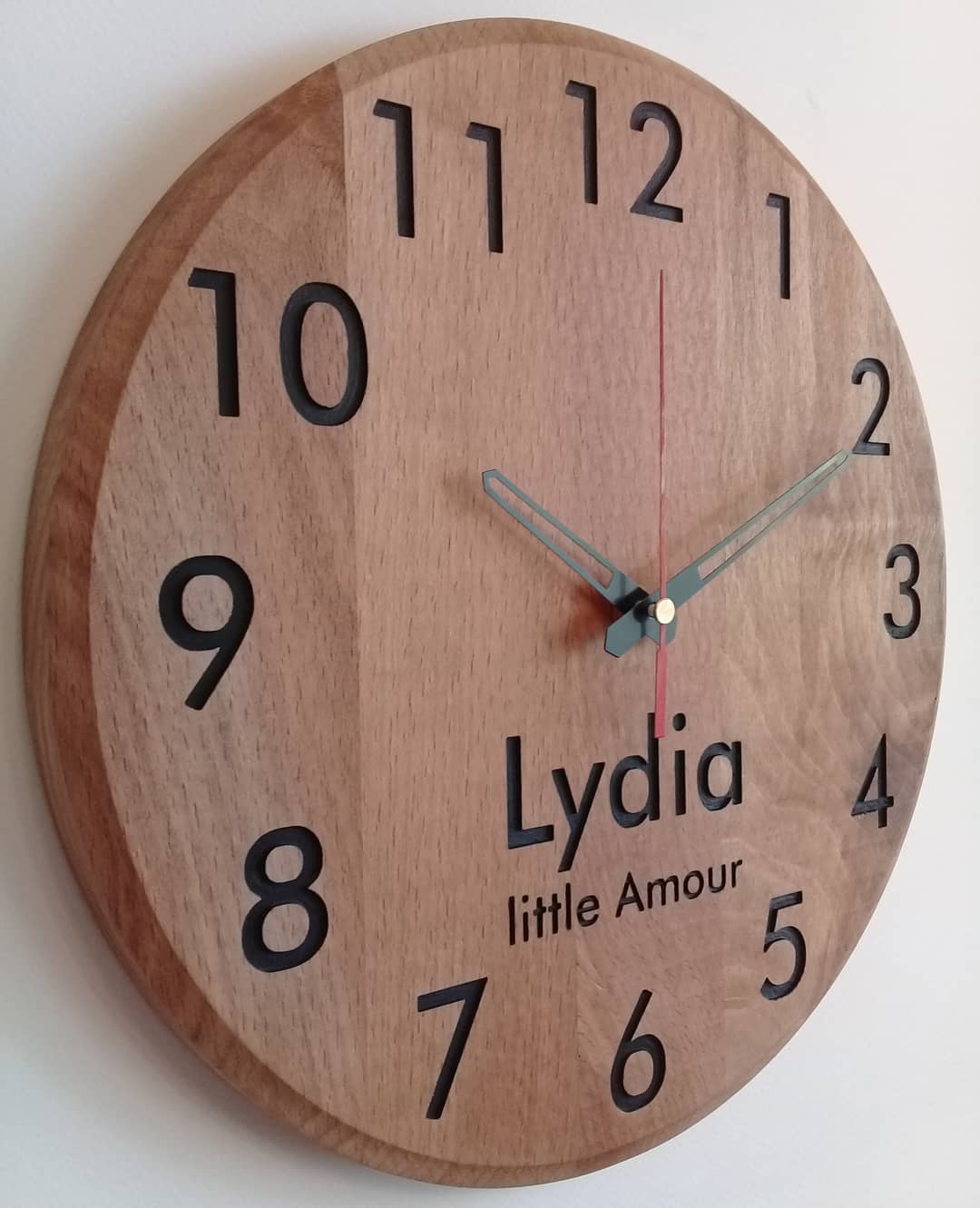 Custom wooden wall clock with the name Lydia and the phrase 'little Amour'