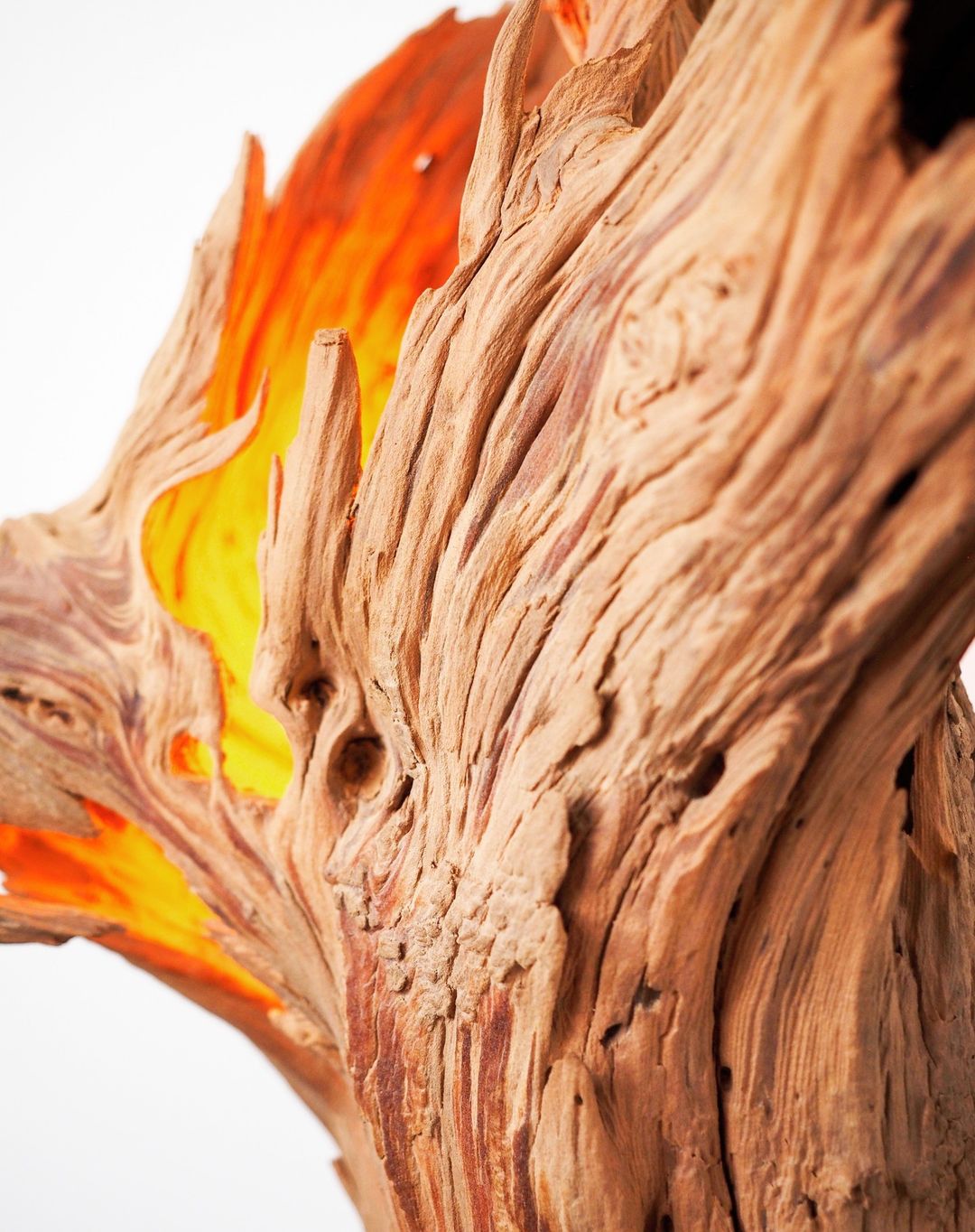 Intricate wooden textures and vivid flames