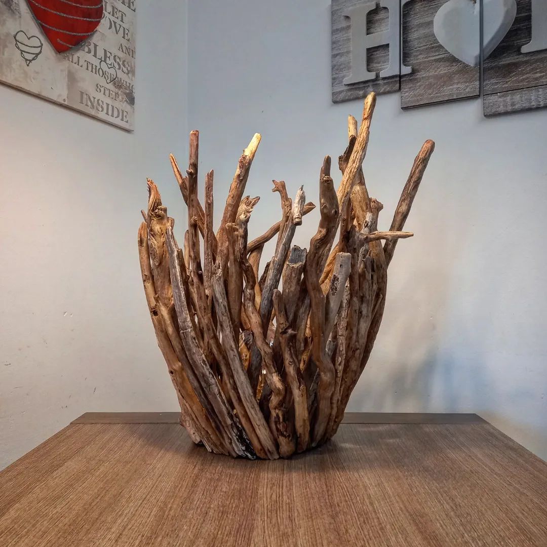 An artistic arrangement of driftwood creating a dynamic centerpiece