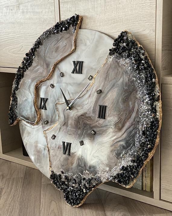 A uniquely crafted wall clock with a geode-inspired design