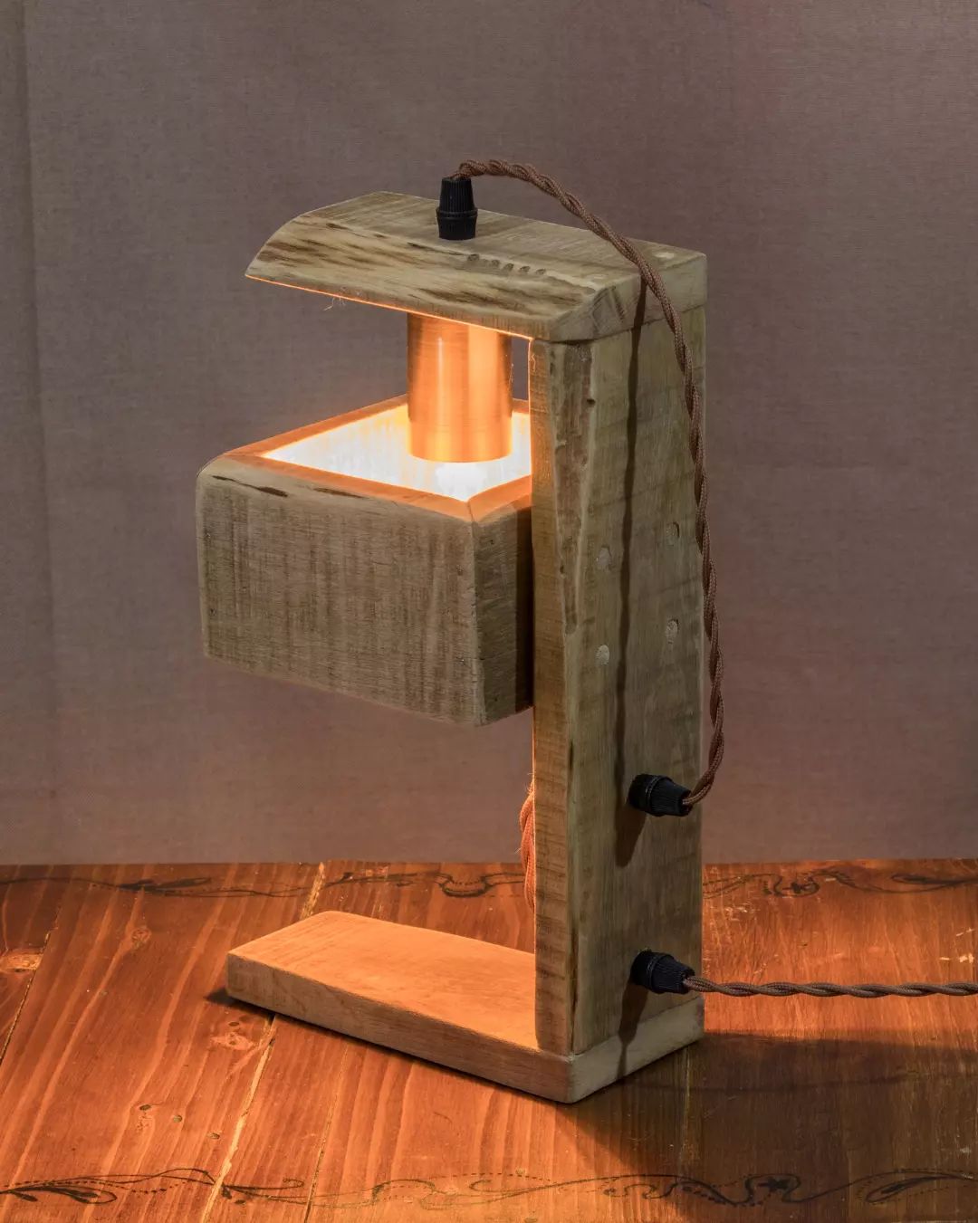 Handcrafted wooden lamp with illuminated interior