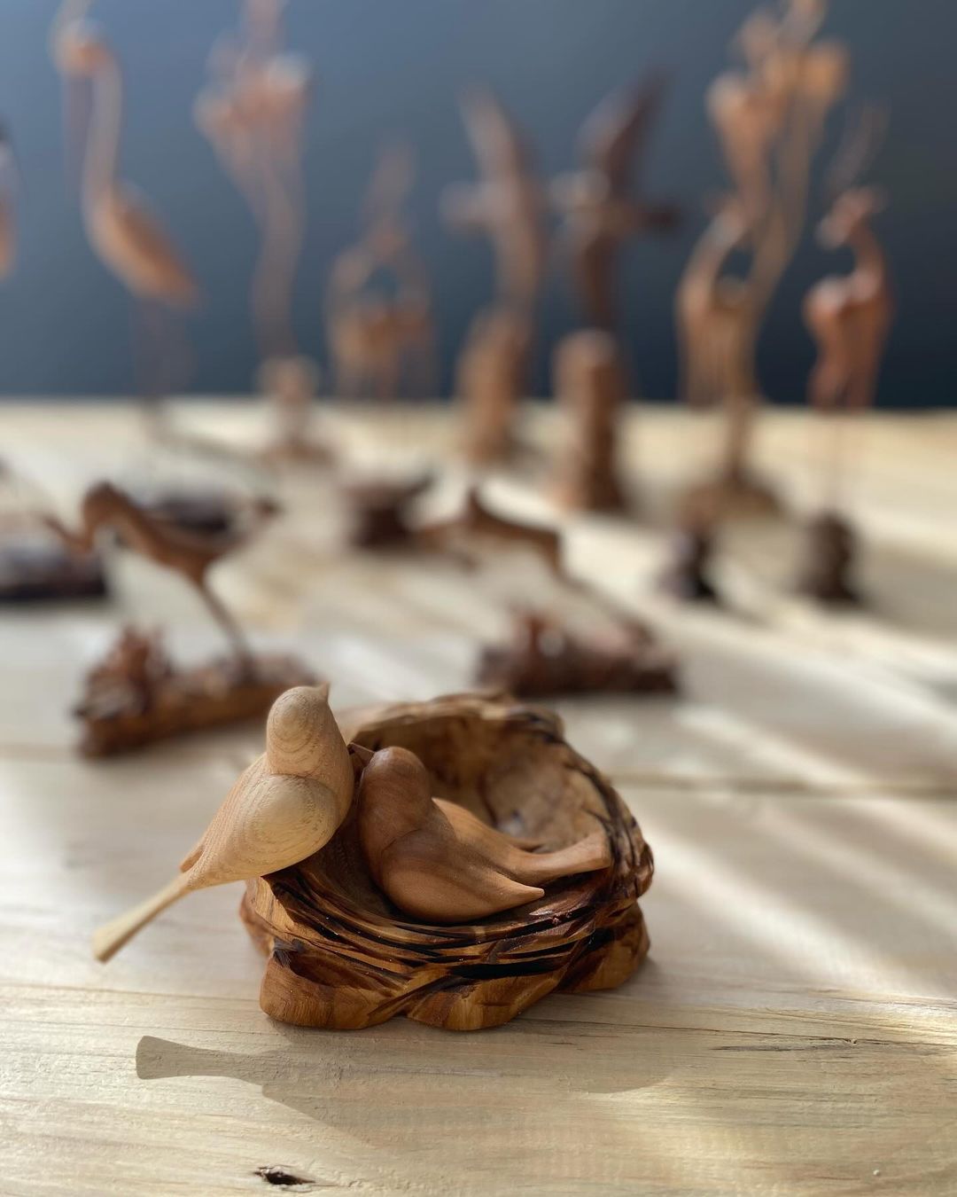 Handcrafted Wooden Birds Nestled in a Bowled Base