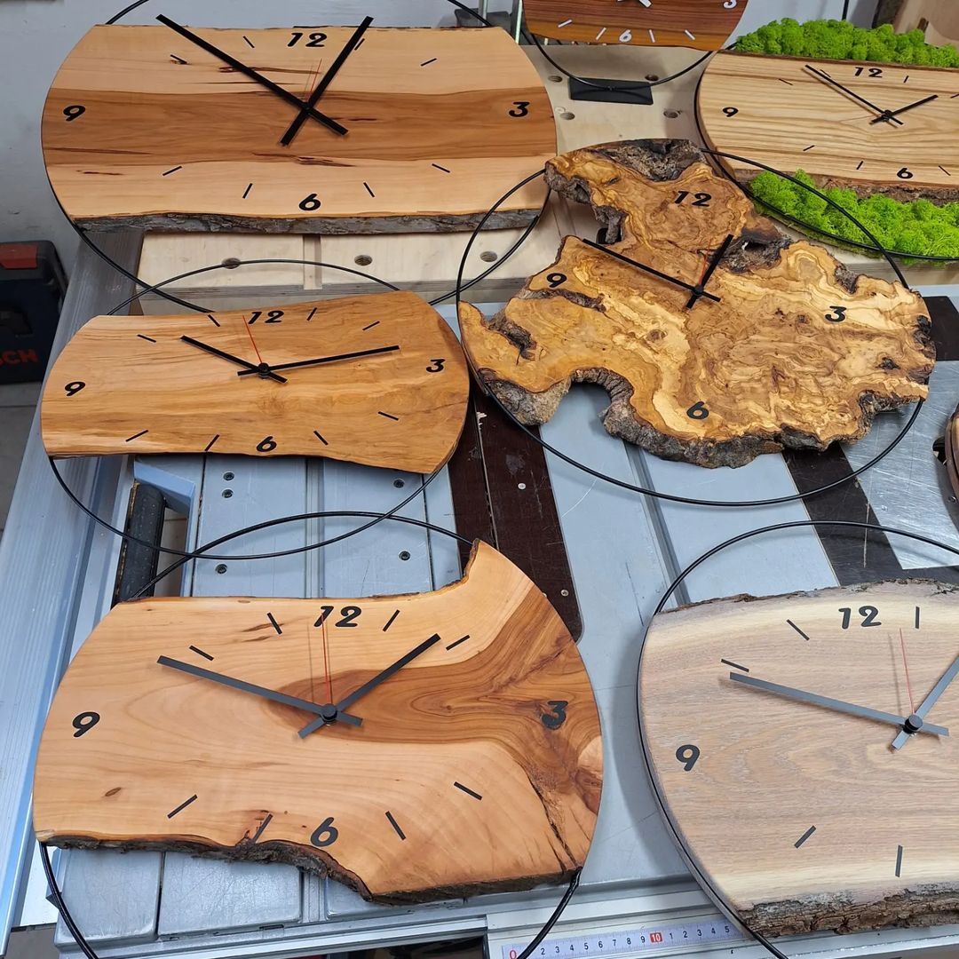 Handcrafted wooden clocks in various shapes and designs