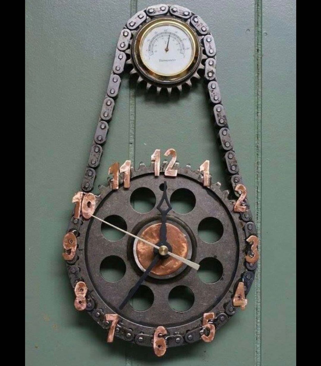 A unique clock made with gear and chain elements giving an industrial touch