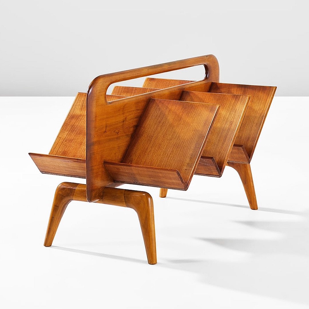 A unique wooden magazine rack with an abstract, geometric design