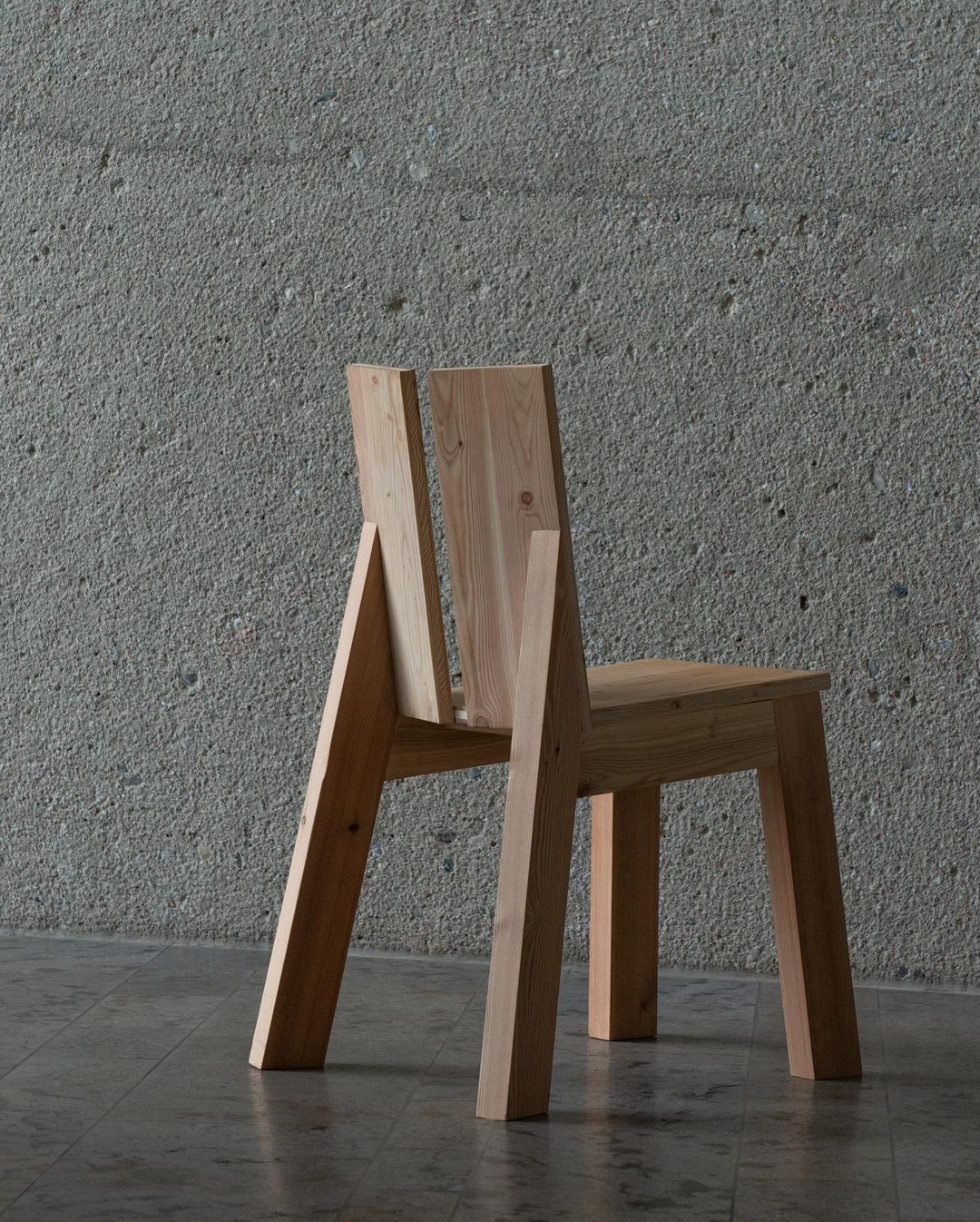 A unique wooden chair with an unconventional design