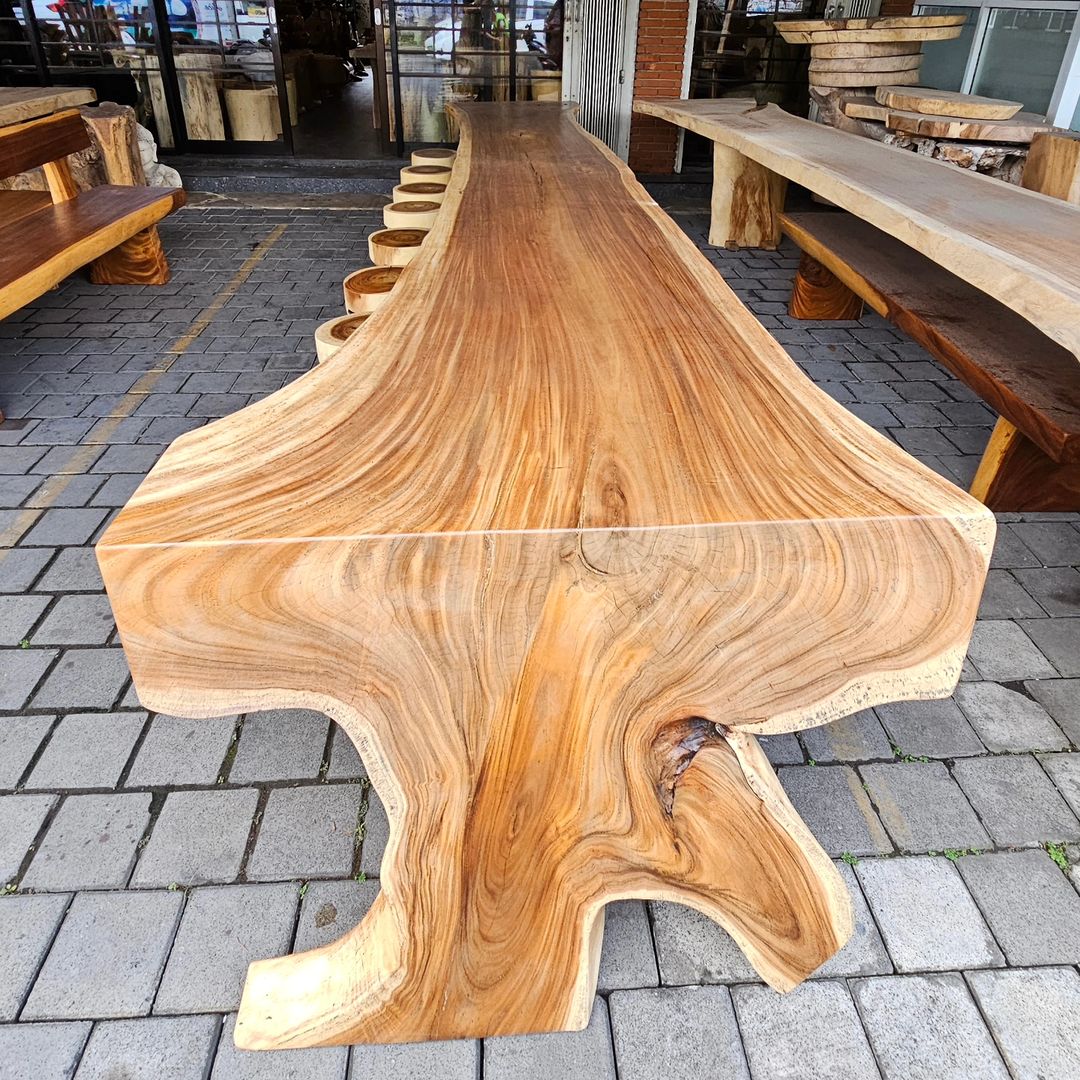 A uniquely designed live-edge wooden table with an organic shape