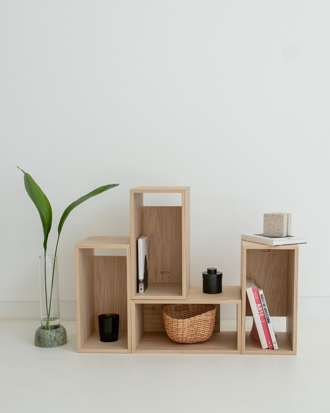 Minimalist wooden shelf arrangement with decor