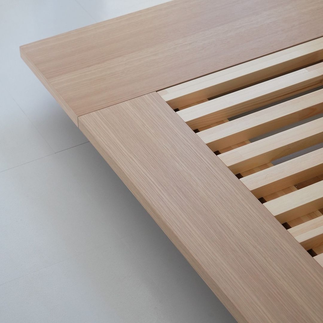 Minimalist wooden bed frame with a focus on natural materials