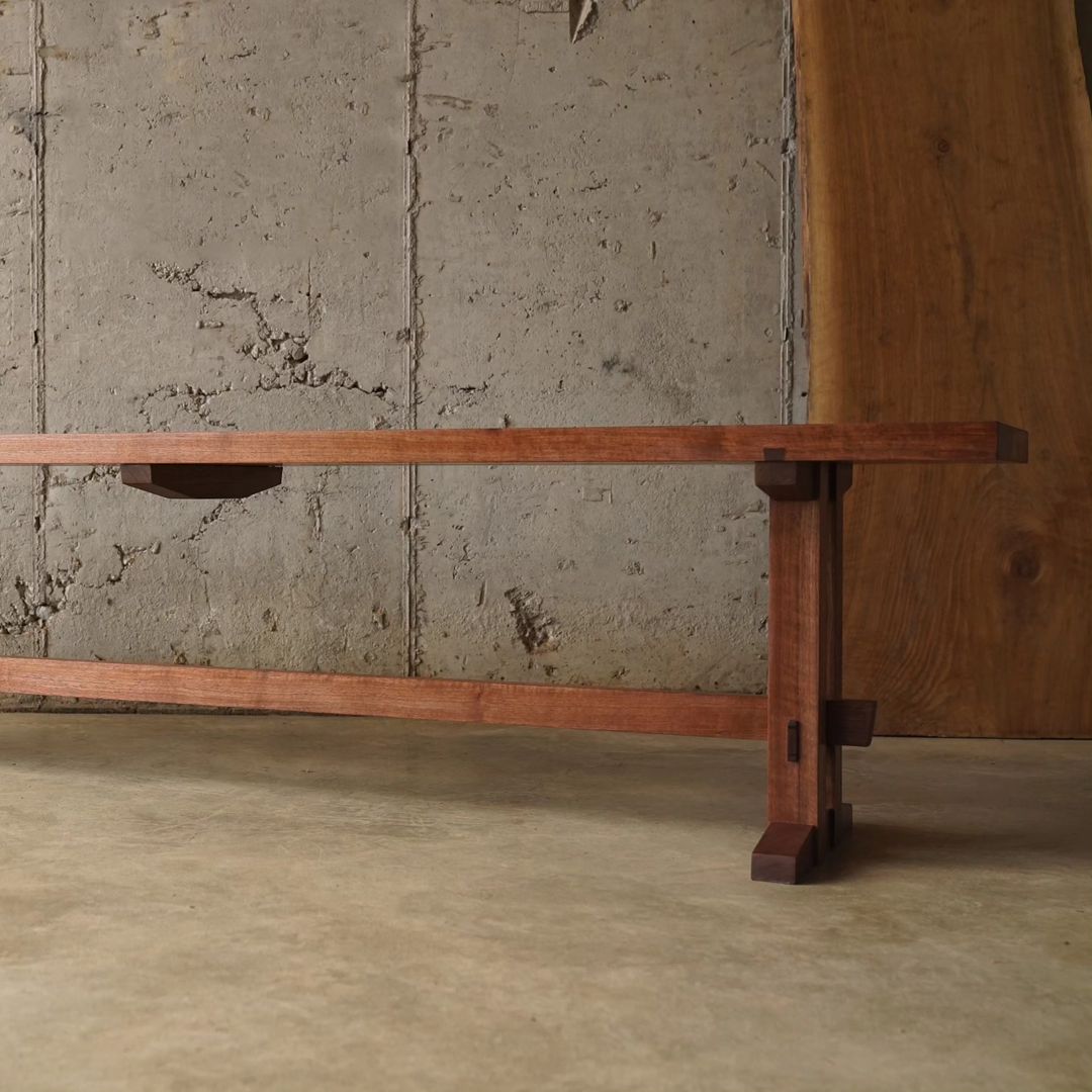 A minimalist wooden bench designed with clean lines and right angles