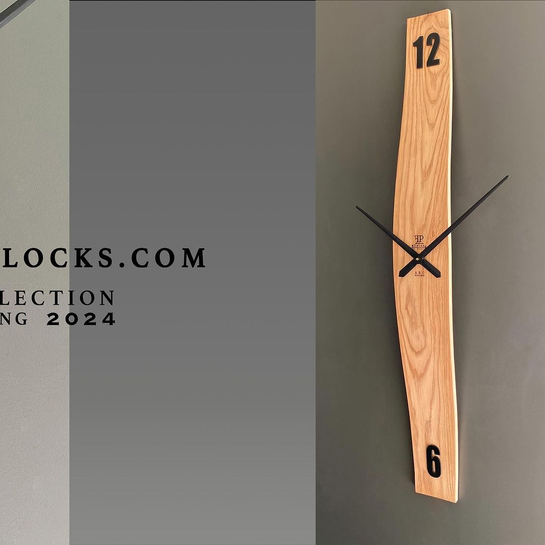 A minimalist wooden wall clock with an unusual vertical design and contrasting black hands