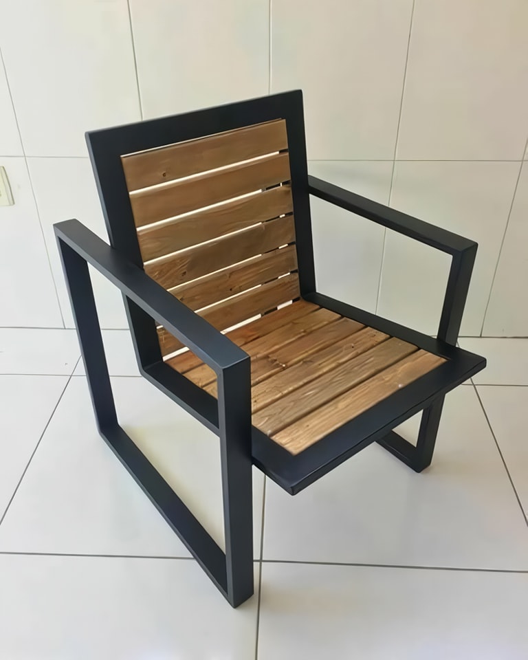 A modern chair with a black frame and wooden slats