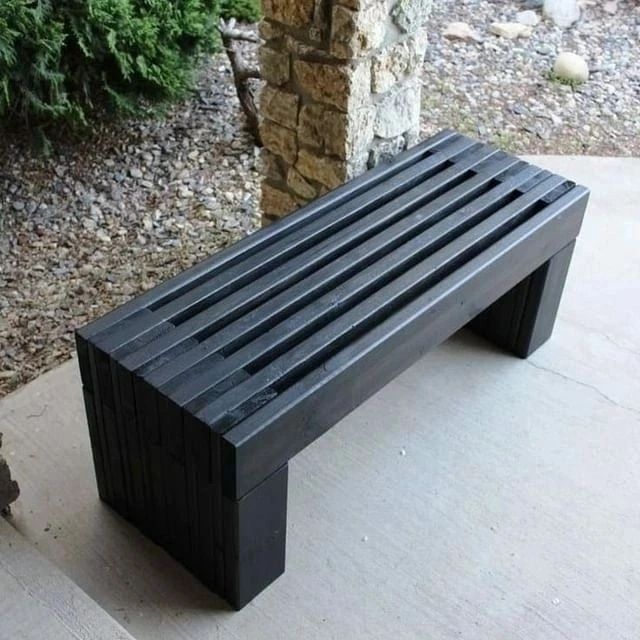 A modern minimalist black bench