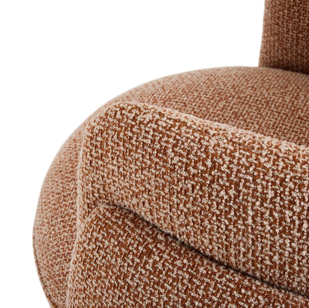 A comfortable brown textured fabric armchair