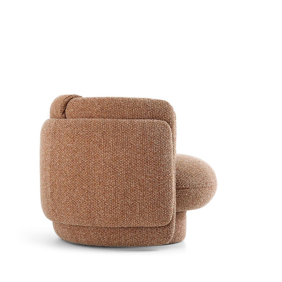 A cozy, textured armchair in a warm brown hue