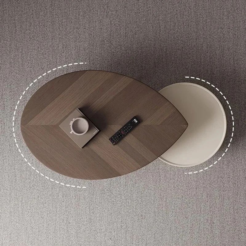 A uniquely designed modern coffee table with circular elements and a built-in book holder