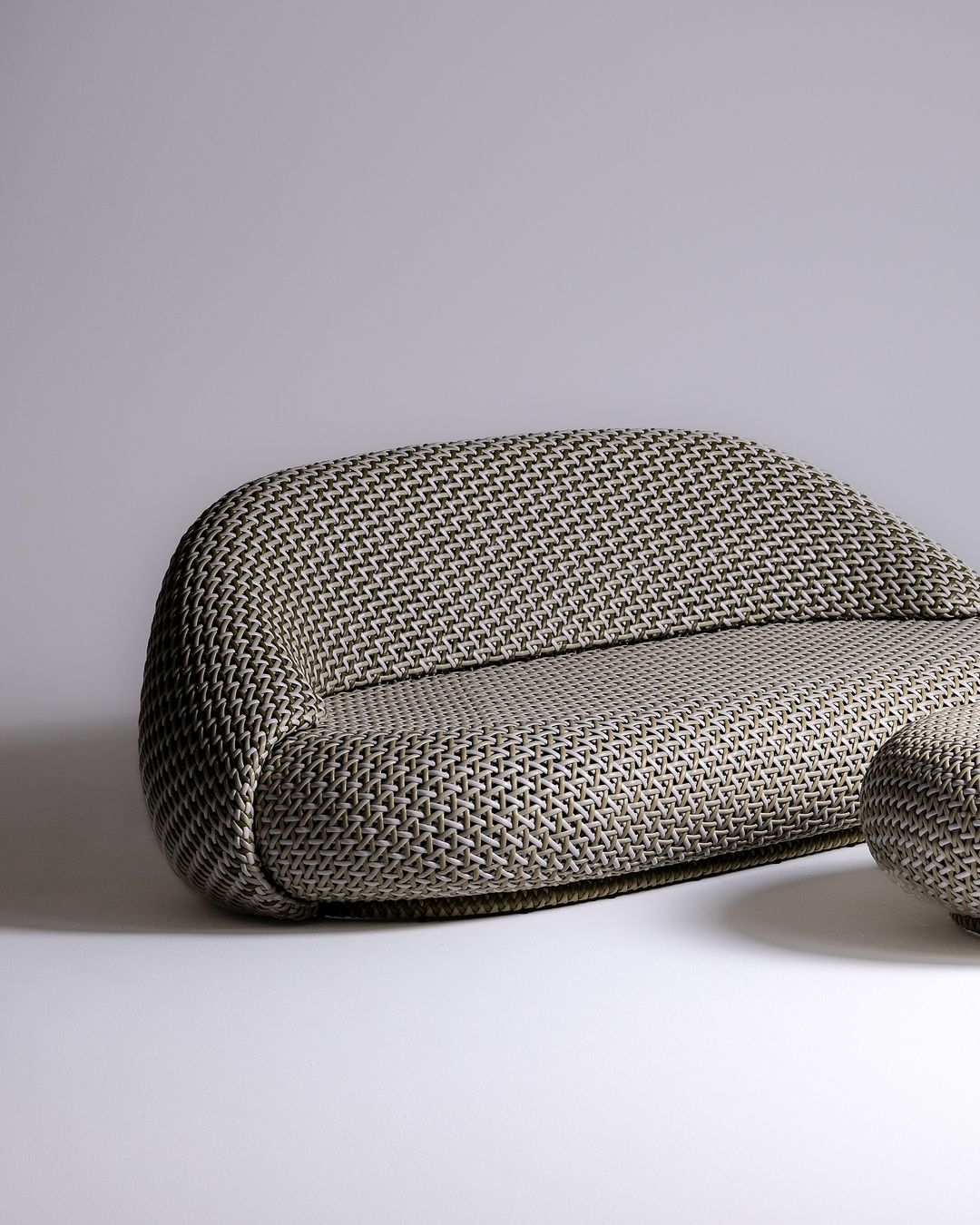 A modern designer sofa with houndstooth upholstery